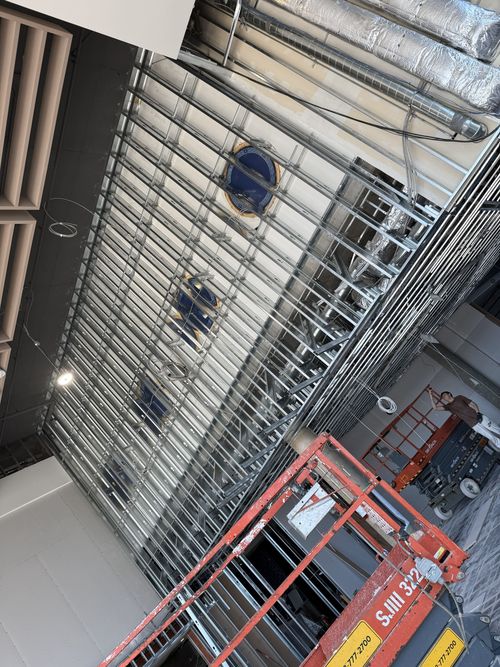 Ceiling metal framing in progress on a commercial Arca Construction job site